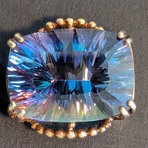 Large Mystic Topaz Stone set in 10 kt gold shank is broken but included
